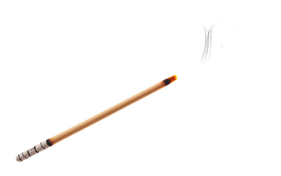 A radiant incense stick emitting fragrant smoke resting in a carved holder Isolated on white Background.