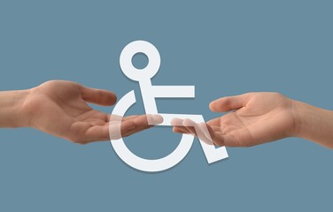 Human hands and Symbol of Access on blue background