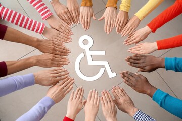 Group of people holding hands together and Symbol of Access