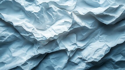 Crumpled texture. Paper waves. Blue hue. Light reflects on folds