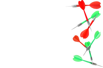 Red and green darts flying on white background