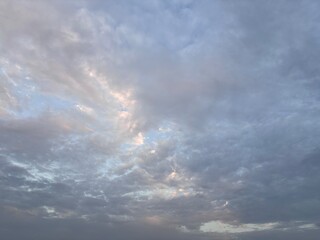 a sky filled with altocumulus clouds with a wavy pattern, creating an interesting texture in the...