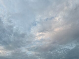 a sky filled with altocumulus clouds with a wavy pattern, creating an interesting texture in the...