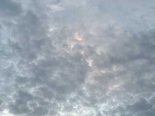 a sky filled with altocumulus clouds with a wavy pattern, creating an interesting texture in the...