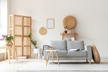 Grey sofa and coffee table in interior of living room