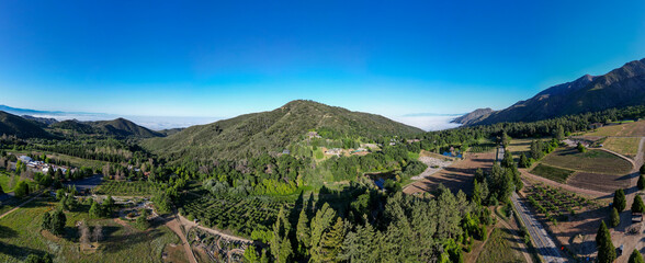 A Beautiful Mountain Scene from the Air with a UAV Drone over a Forest In Oak Glen., 
