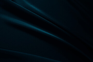 Black deep dark blue green greenish petrol abstract background. Silk satin shiny soft fabric surface. Elegant rich luxury festive. Diagonal curve wavy line stripe fold. Design. Template.