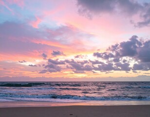 Obraz premium Vibrant Sunset Over Ocean Waves with Colorful Sky and Clouds