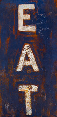 Rustic roadside “EAT” sign evokes vintage charm and classic American travel