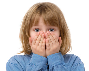 Young girl with blonde hair is covering her face with her hands, expressing surprise or fear. She wears blue shirt and has wide, expressive eyes that convey strong emotional reaction
