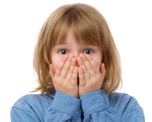 Young girl with blonde hair is covering her face with her hands, expressing surprise or fear. She wears blue shirt and has wide, expressive eyes that convey strong emotional reaction