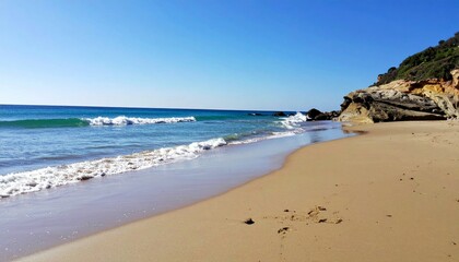 Serene Seashore with Gentle Waves and Clear Blue Sky
