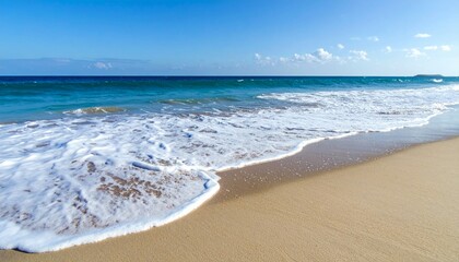 Fototapeta premium Serene Ocean Waves Gently Lapping Golden Sandy Beach Shoreline