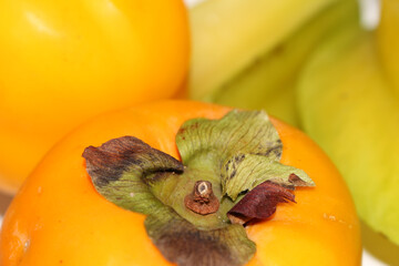 Persimmon and Star Fruit. Focused Persimmon. Blurred Star Fruit.