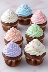 Pastel Cupcakes with Chocolate Base and Sprinkles on Pink Background