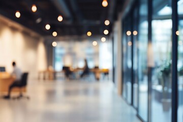  Abstract Blurred View of a Contemporary Co-working Space with Individuals Working at Desks and Soft Interior Lighting