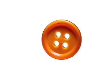 Obraz premium Close-up of an orange plastic button against a white background.