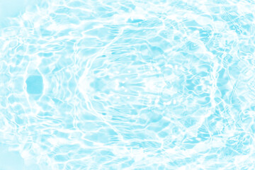 Blue water with ripples on the surface. Defocus blurred transparent blue colored clear calm water surface texture with splashes and bubbles. Water waves with shining pattern texture background.