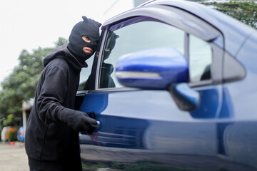 Thief in Black Attempting to Steal Car From Residential Parking Area.