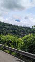 Mt Agung volcano covered in clouds in Amed on tropical island of Bali, Indonesia