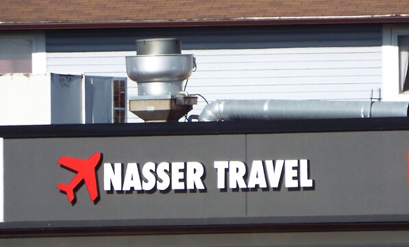 Ottawa, ON, Canada-May 22,2025: A close-up of a sign for "NASSER TRAVEL" at 1247 Donald street.
