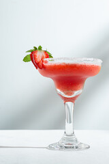 Refreshing Strawberry Daiquiri cocktail with Sugar Rimmed Glass and Fresh Garnish