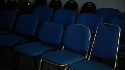 Rows of Empty Blue Chairs in a Conference Room or Auditorium