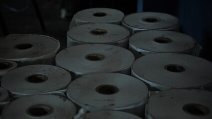 Rolls of Paper Stockpiled in Warehouse Industrial Photography