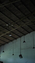 Dark Wooden Beams and Industrial Lighting Architectural Interior Detail