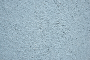 Textured blue wall surface with unique patterns and tones
