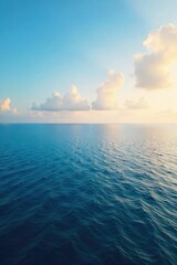 Vast, endless ocean meeting the sky at the horizon Calm water stretches to the distant, hazy line where sea and sky blend seamlessly A tranquil scene of breathtaking natural beauty , waves, nature