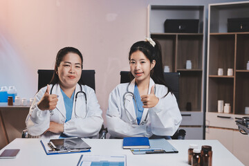 Fototapeta premium doctors and nurse having informal meeting in hospital canteen