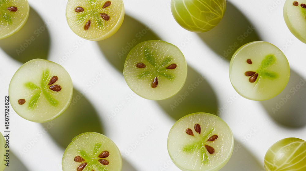 Poster close-up of halved green gooseberries arranged in a geometric pattern with visible seeds and shadows
