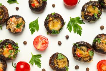Stuffed mushrooms, tomatoes and spices on white background, top view