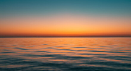 Obraz premium Serene Sunset over Calm Ocean Waters Vibrant Orange and Teal Sky