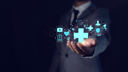 Businessman holding medical icon for health insurance concept