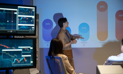 Asian businessman presentations slides chart graphs of work professionals collaborating on a...
