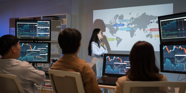 Businesswoman presents a marketing strategy using a ship route map, promoting global product distribution and sales logistics in a corporate setting during a professional presentation.