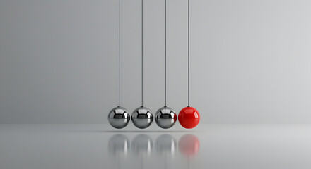 Newton's Cradle with Chrome and Red Balls on a Glossy White Surface Against Gray Background