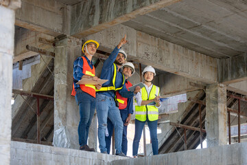 Team of engineer, architect, contractor and foreman meeting and consulting in construction building...