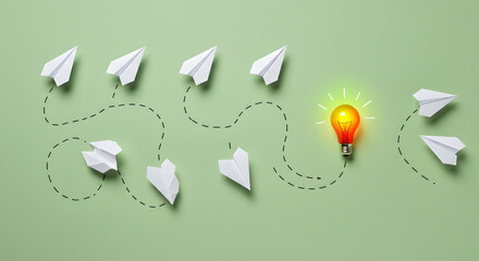 Paper Airplanes Following Dashed Lines Leading to a Glowing Red Light Bulb on Green Background Representing Idea