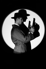A dark silhouette of a male detective in a coat and hat with a gun in his hands in the noir style. A dramatic portrait in the style of detective films of the 1950s. The silhouette of a spy in a circle