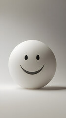 A spherical sculpture with a cheerful smiling expression, set against a neutral background.