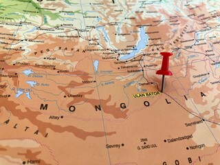 Fototapeta premium View of Ulaanbaatar, Capital and largest city of Mongolia, on a geographical map of Asia, marked with red pushpin