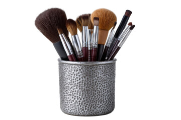 Assortment of makeup brushes in a silver holder