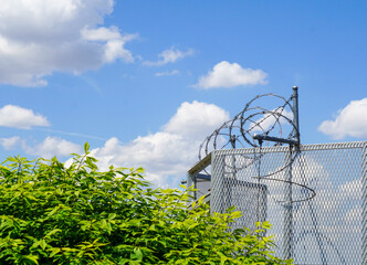 Barbed wire fence and security gate