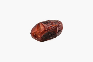 Dried date on a plain background showcases natural texture