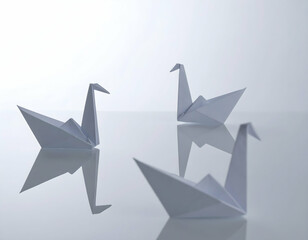 Elegant Origami Swans Reflecting on a Calm Surface A Study in Paper Art