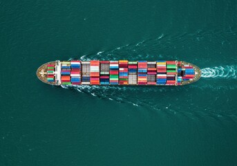 Aerial view of container ship transporting cargo on the ocean surface