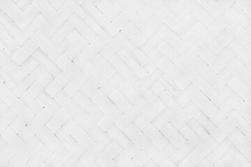 Fototapeta premium Old white bamboo weaving pattern, woven rattan mat texture for background and design art work.